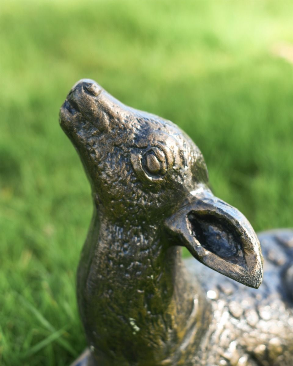 Close up of detail on face on brushed bronze deer garden sculpture 