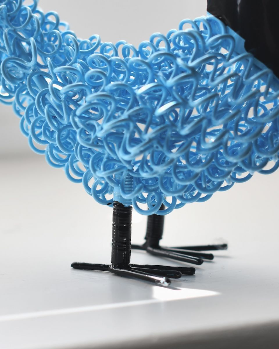 Close up of feet detail on recycled cockerel sculpture 