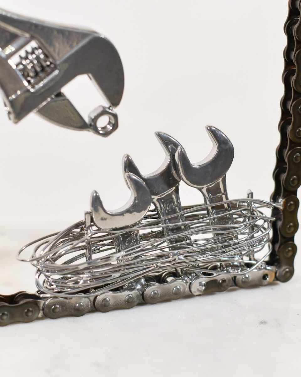 Close up of bird nest detail on scrap metal sculpture