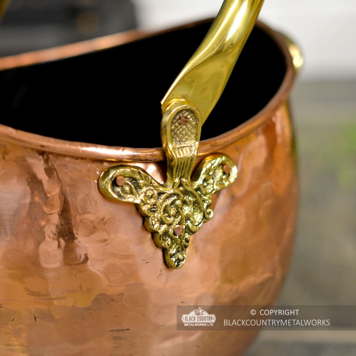 Ornate Design on the Side of the Coal Bucket Ornate Design on the Side of the Coal Bucket