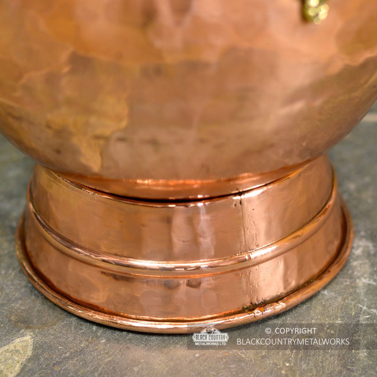 View of the Base of the Copper Coal Bucket View of the Base of the Copper Coal Bucket