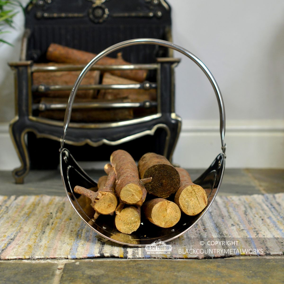 "Evington" Stainless Steel Curved Log Basket Holding Logs