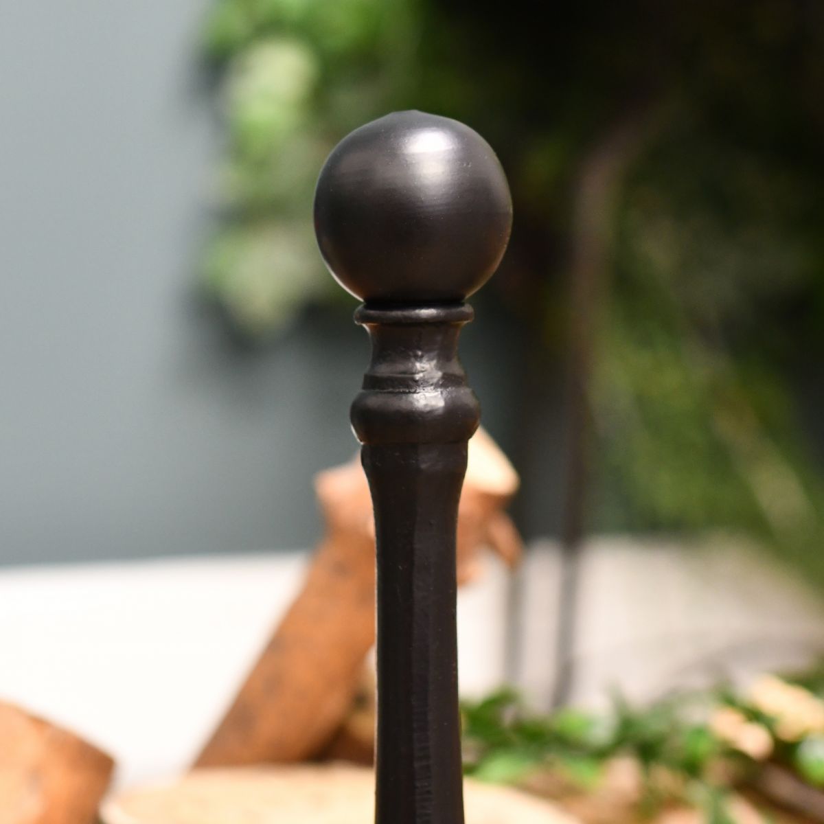 Finial on traditional fire grate fire dogs