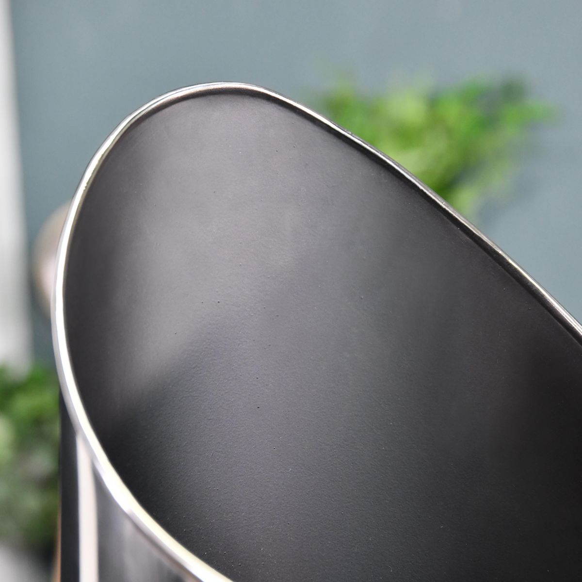 Close up of curved coal hod 