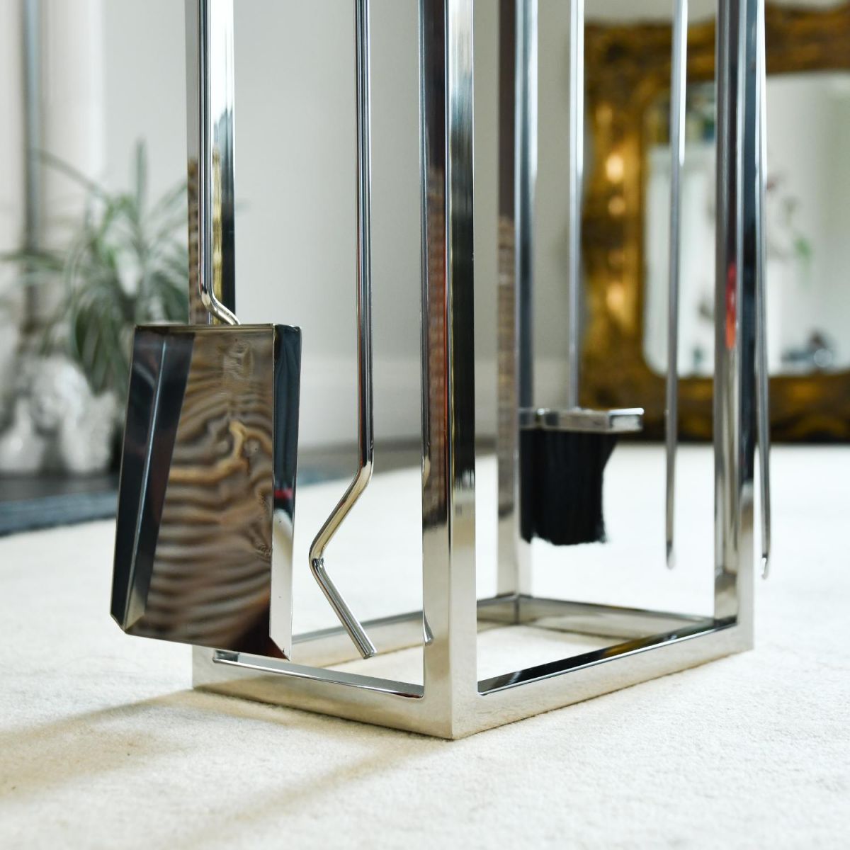 Close up of Polished Stainless Steel Log Holder and Companion Set 