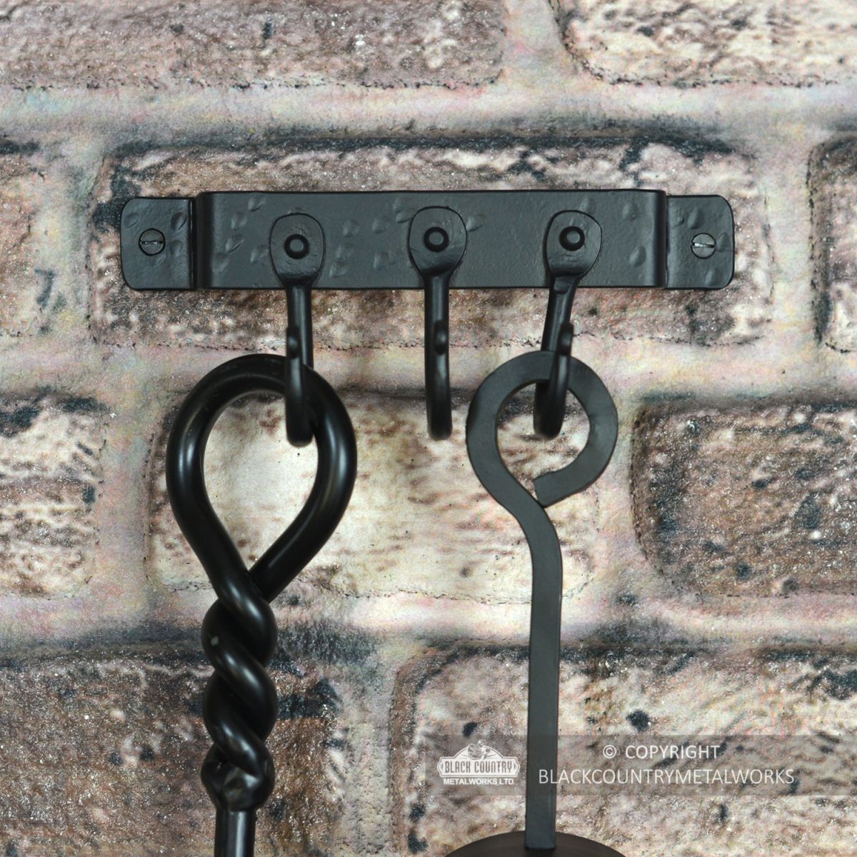 3 Hook "Blacksmith Style" Wall Mounted Fireside Tool Rack in Situ on the Wall holding tools