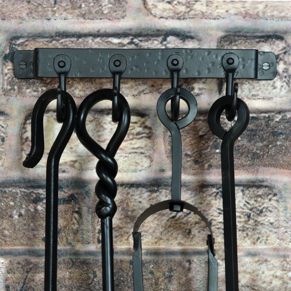 4 Hook "Blacksmith Style" Wall Mounted Fireside Tool Rack in Situ on the Wall holding tools 4 Hook "Blacksmith Style" Wall Mounted Fireside Tool Rack in Situ on the Wall holding tools