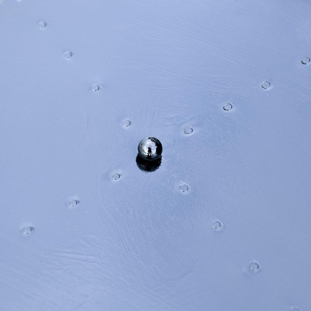 Close up of steel lid and ball handle