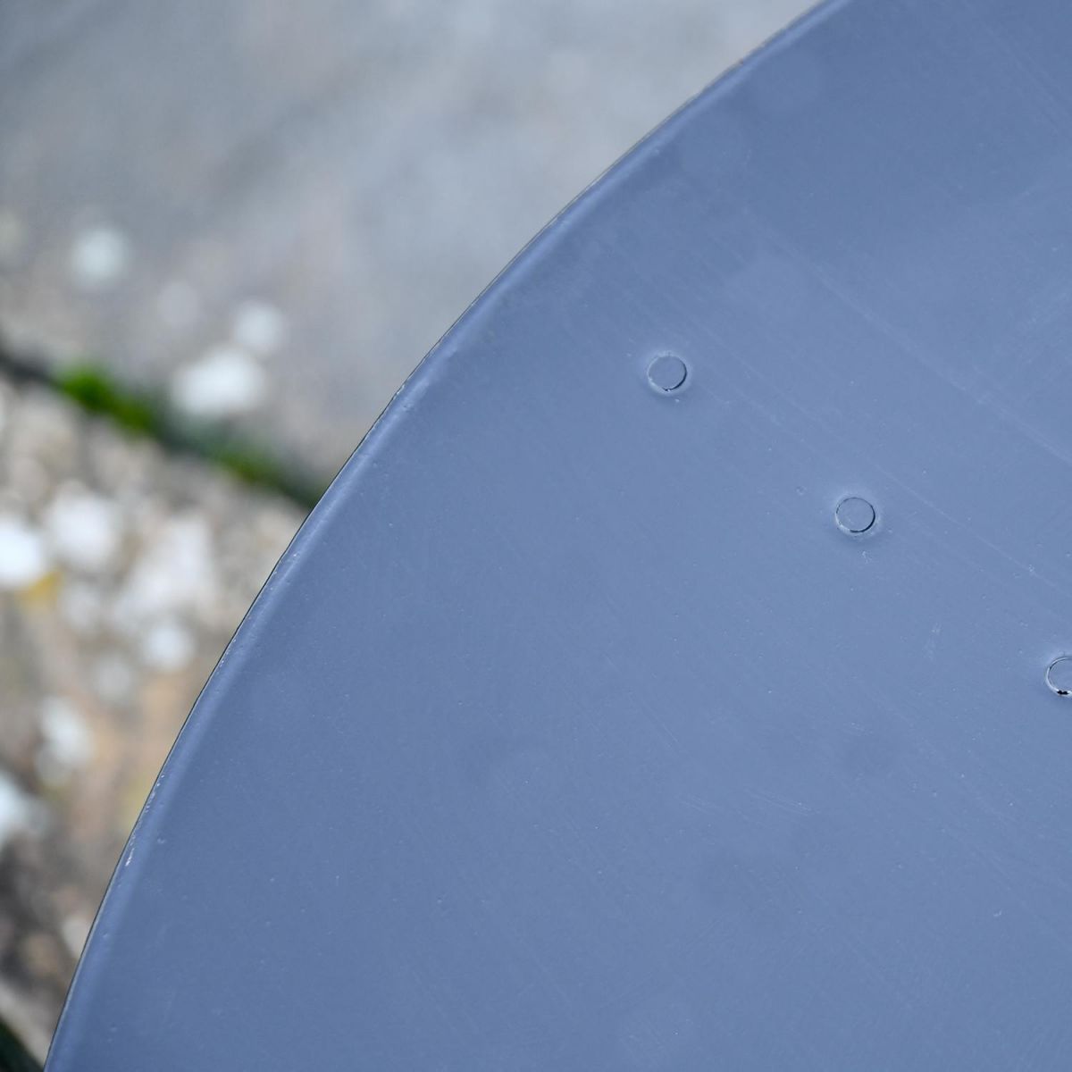 Close up of curved firebowl lid 