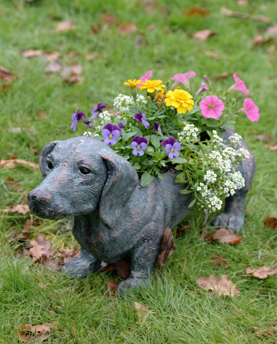 "Digby" the Sausage Dog Cast Aluminium Planter - Verdigris with flowers coming out the top