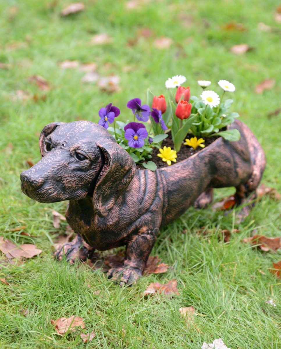 "Digby" the Sausage Dog Cast Aluminium Planter - Copper with flowers in planter