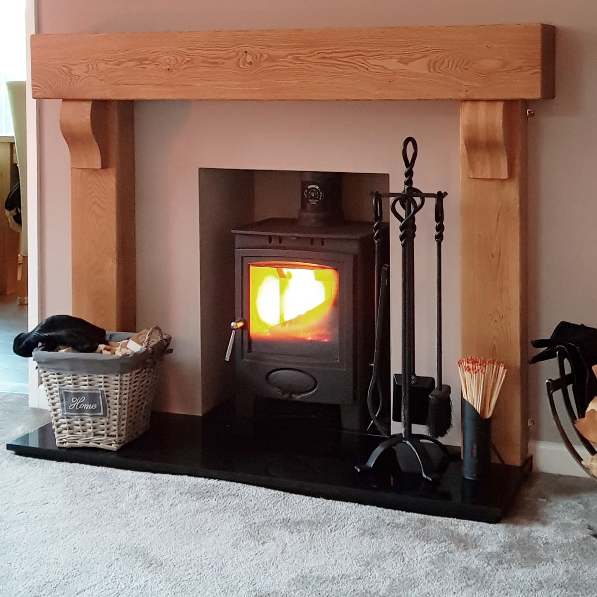 Blacksmith Knot Iron Companion Set next to log burner