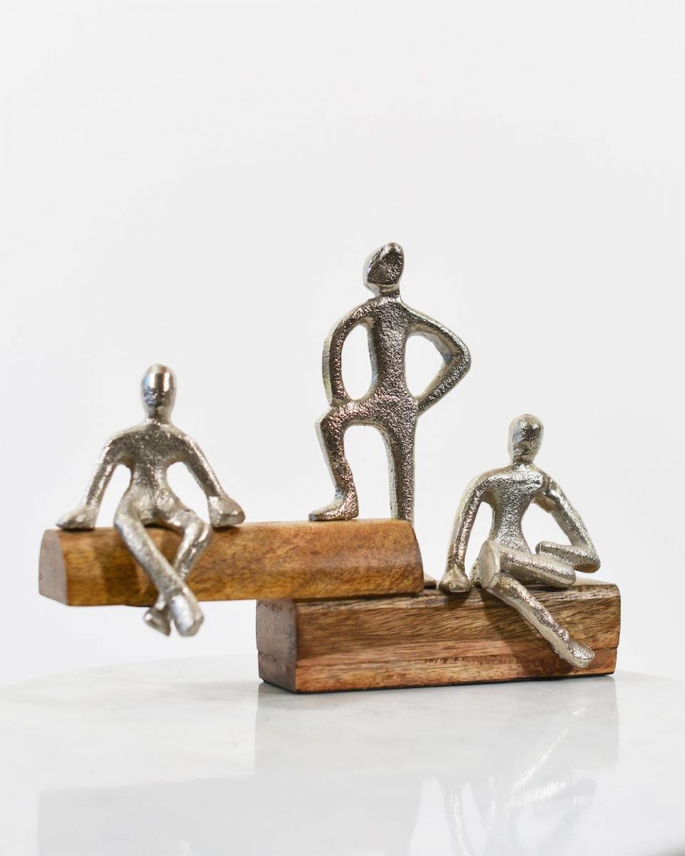 Angled view of cast aluminium and mango wood interior ornament Angled view of cast aluminium and mango wood interior ornament