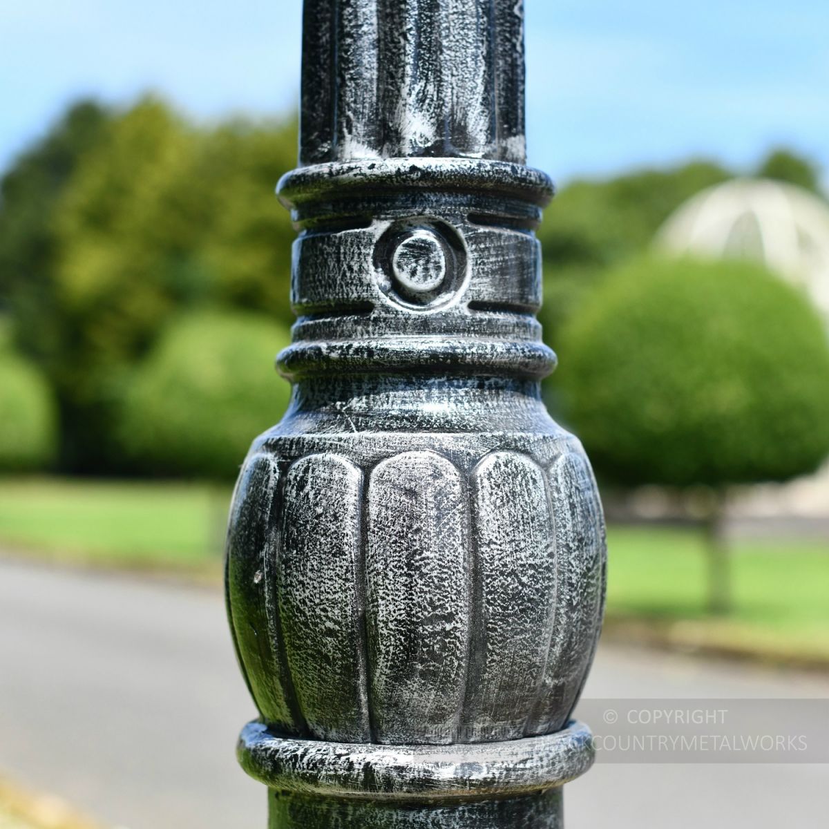 Floral Detailing on antique grey lamp post column Floral Detailing on antique grey lamp post column