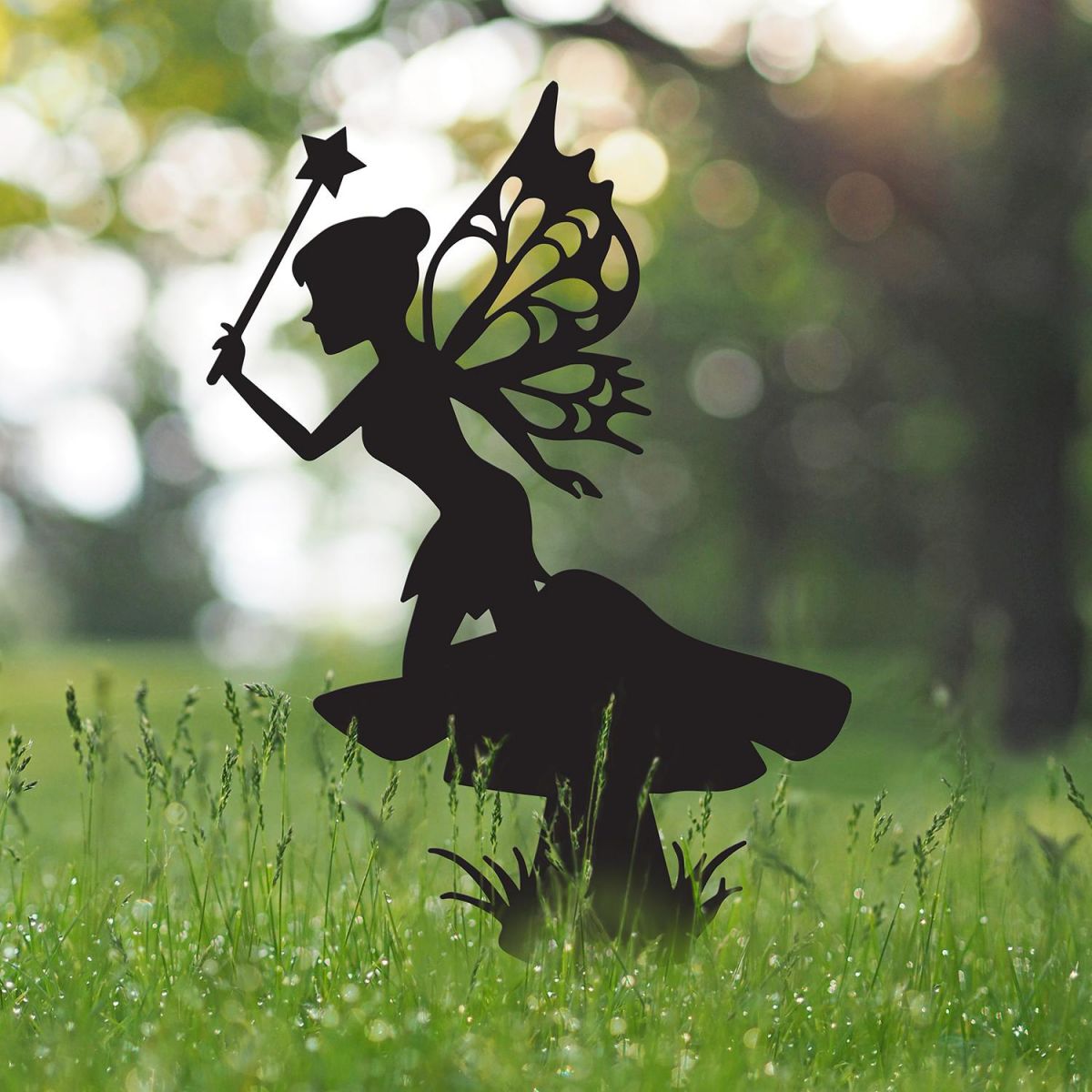 Flower Fairy With Wand Silhouette in Situ in the Garden Flower Fairy With Wand Silhouette in Situ in the Garden