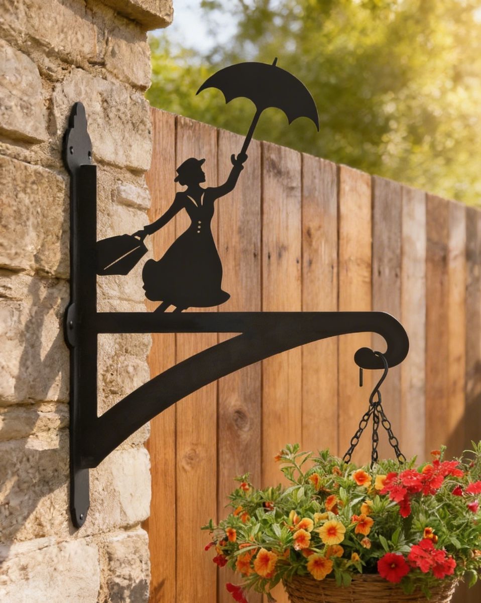 Digital representation of Flying Nanny Iron Hanging Basket Bracket mounted on brick wall with fence in background