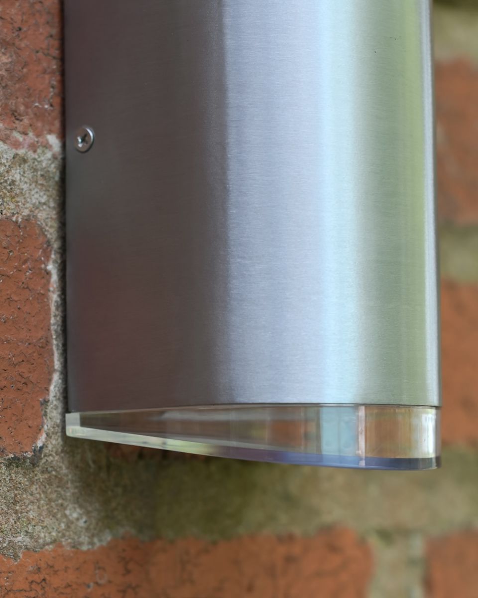 Close up of aluminium detail on garden wall light Close up of aluminium detail on garden wall light