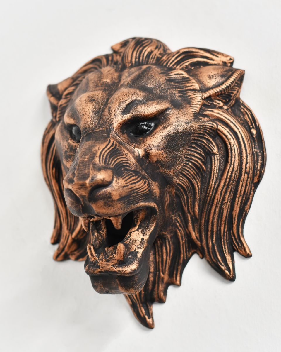 Front view of intricately detailed lion head wall bust