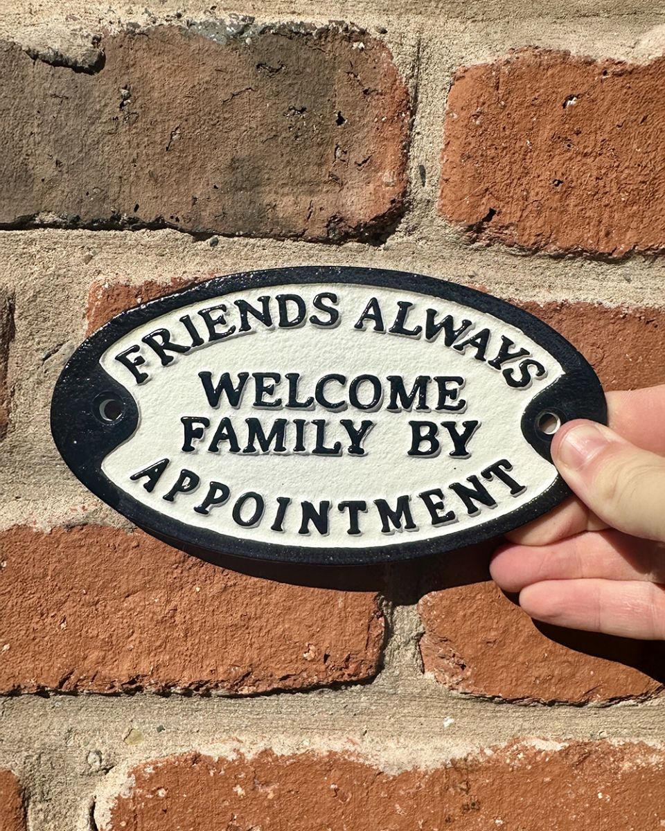 Cast iron friends always welcome wall sign