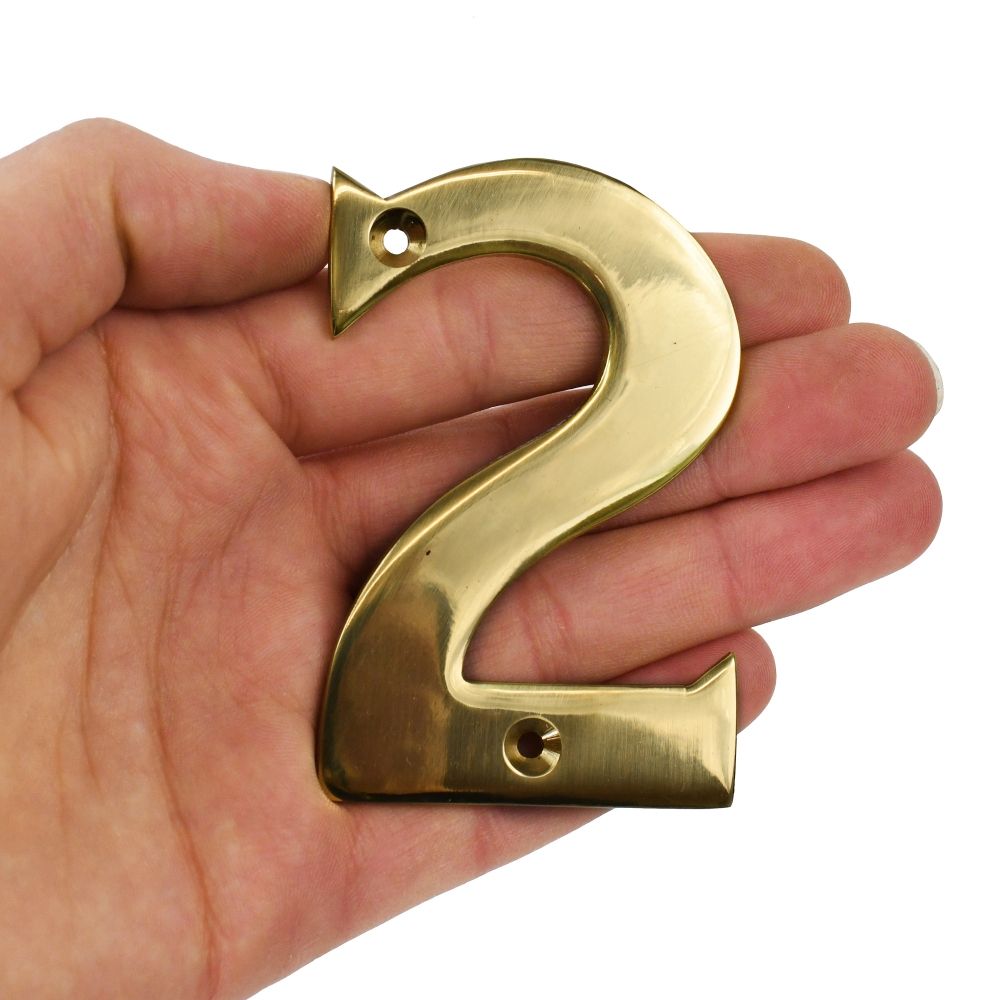 Brass number 2 in hand