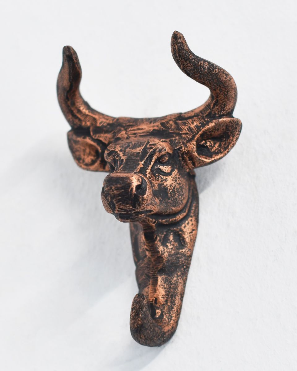 Front view of intricately detailed copper coat hook