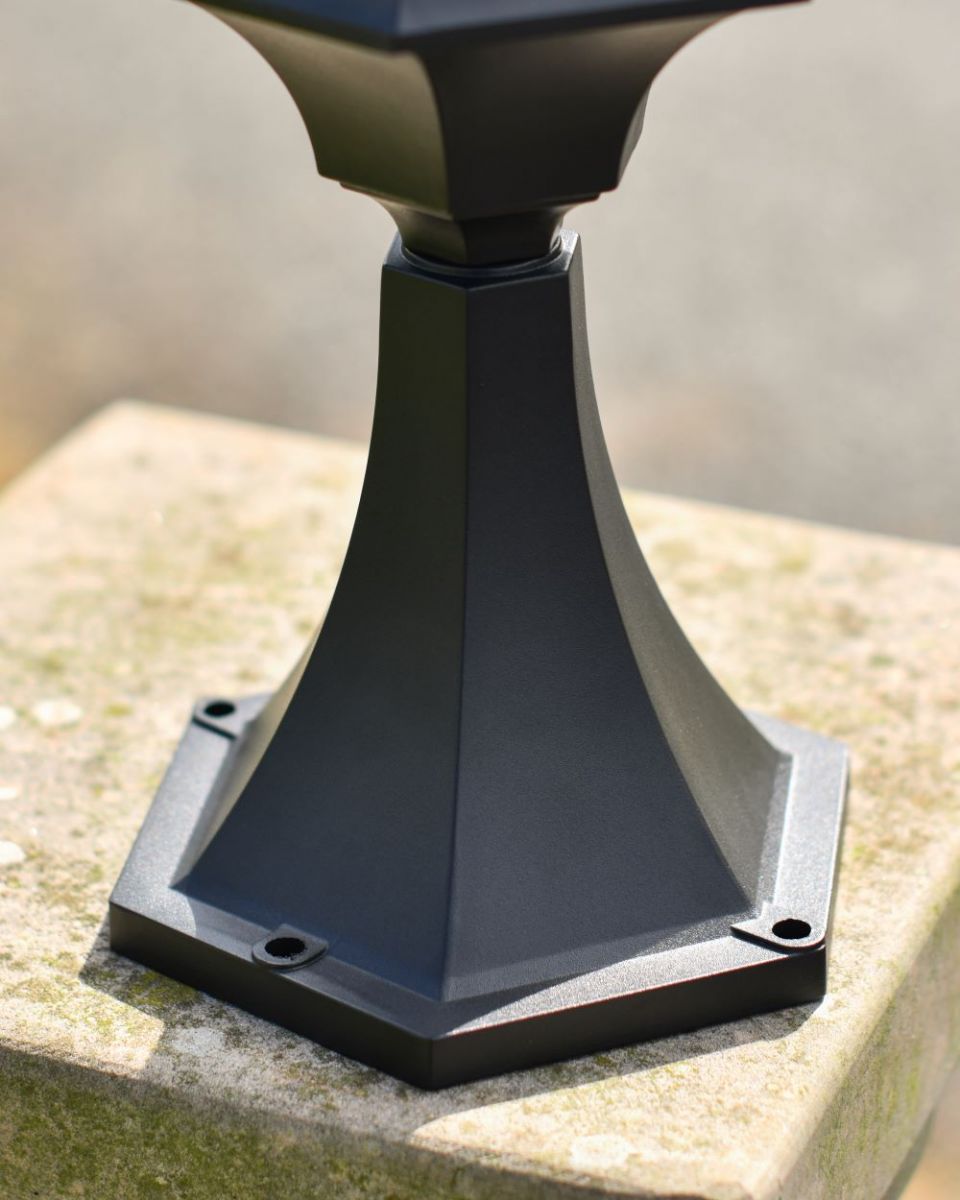 Close up of intricate frosted glass pillar light base