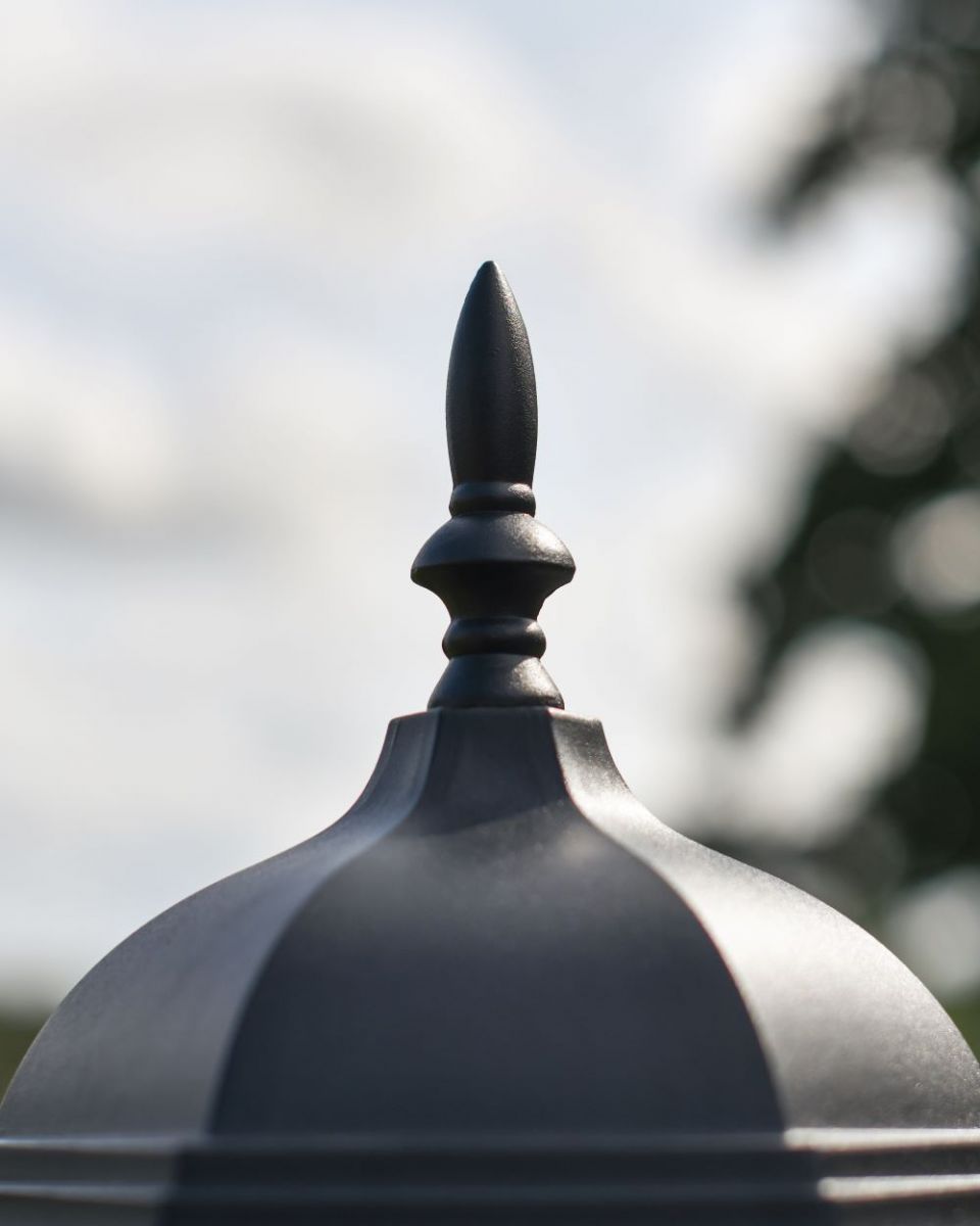 Close up of finial on top of Intricate Frosted Glass Pillar Light