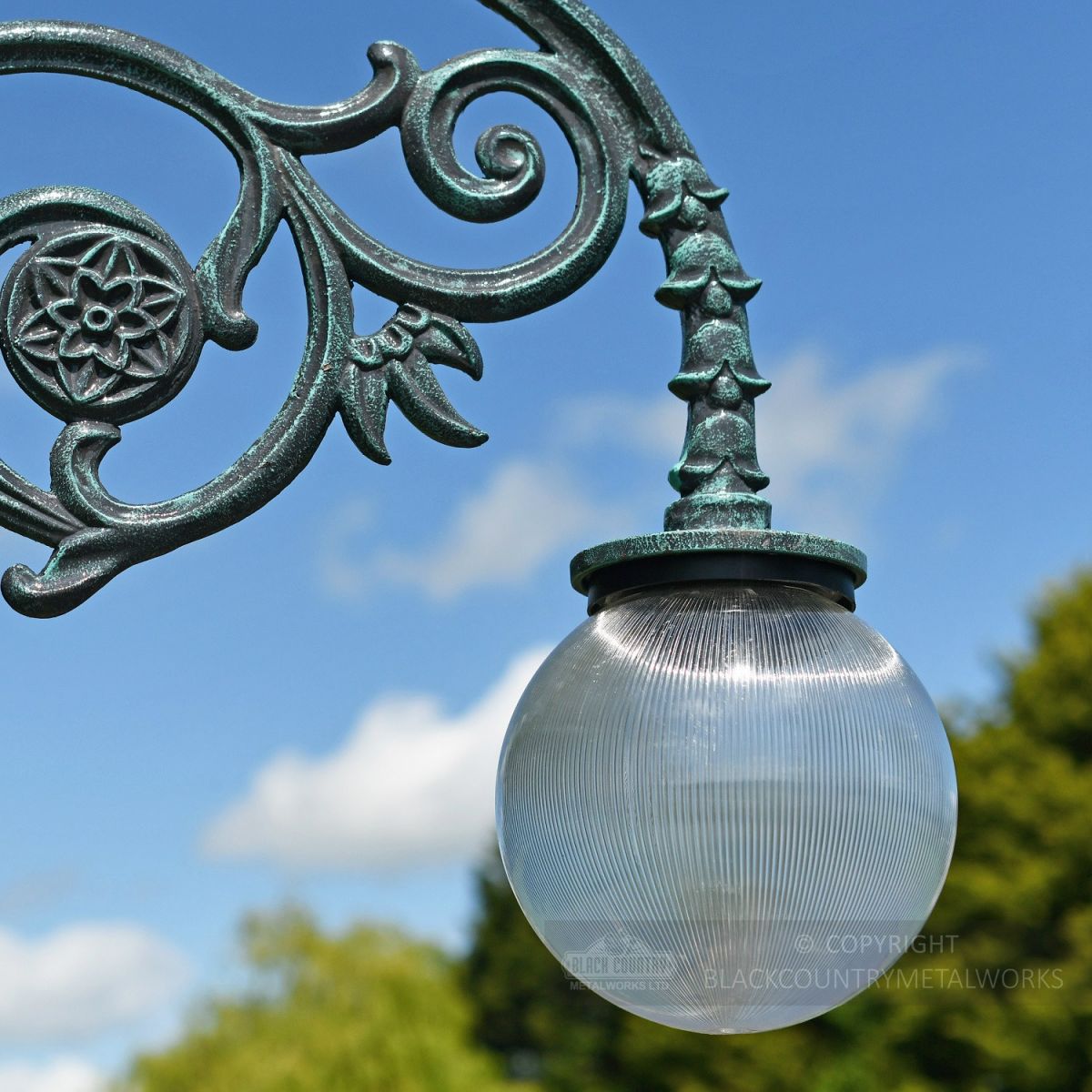Frosted Globe Luminaire on cast lamp post bracket