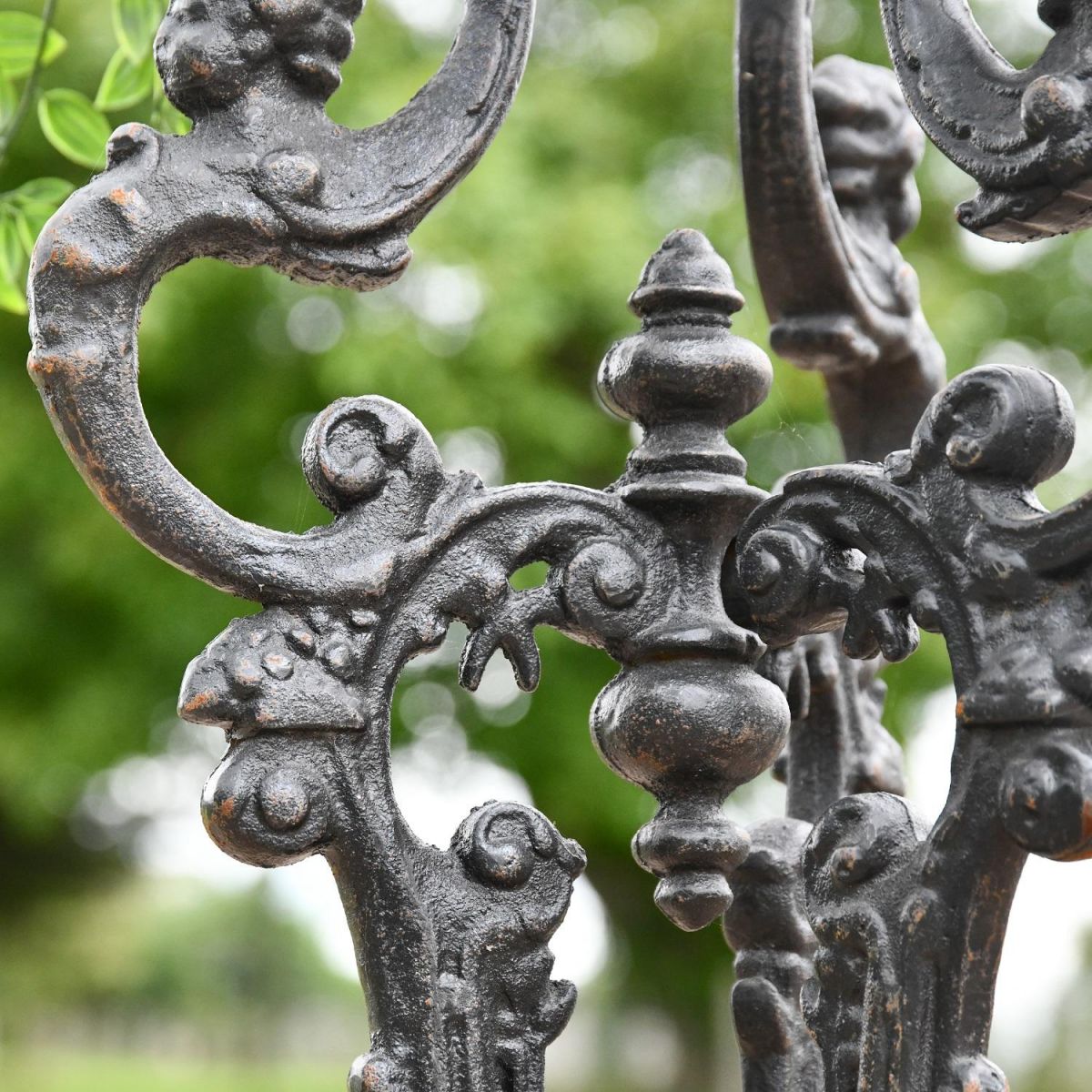 Close up of detailing within Long Gothic Aged Black Side Table