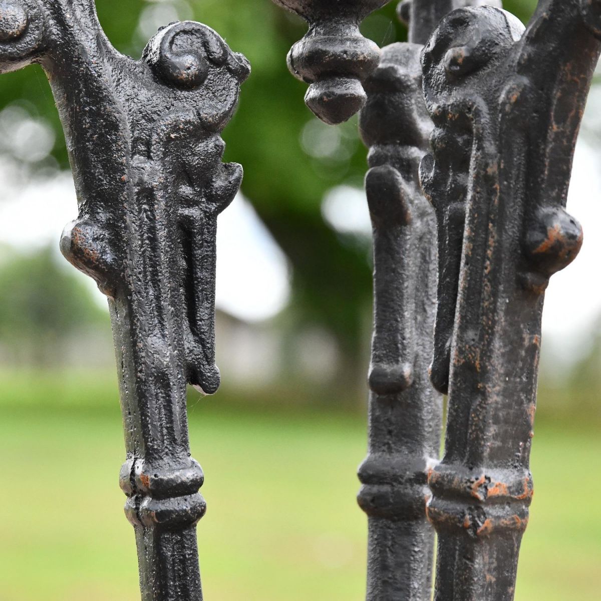 Close up of Aged Black Cast Iron Table Legs