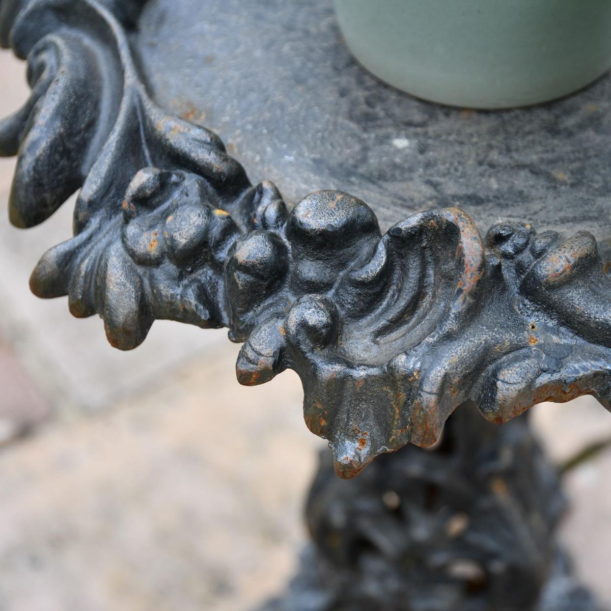 Close up of Gothic embellishments on Aged Black Side Table Close up of Gothic embellishments on Aged Black Side Table