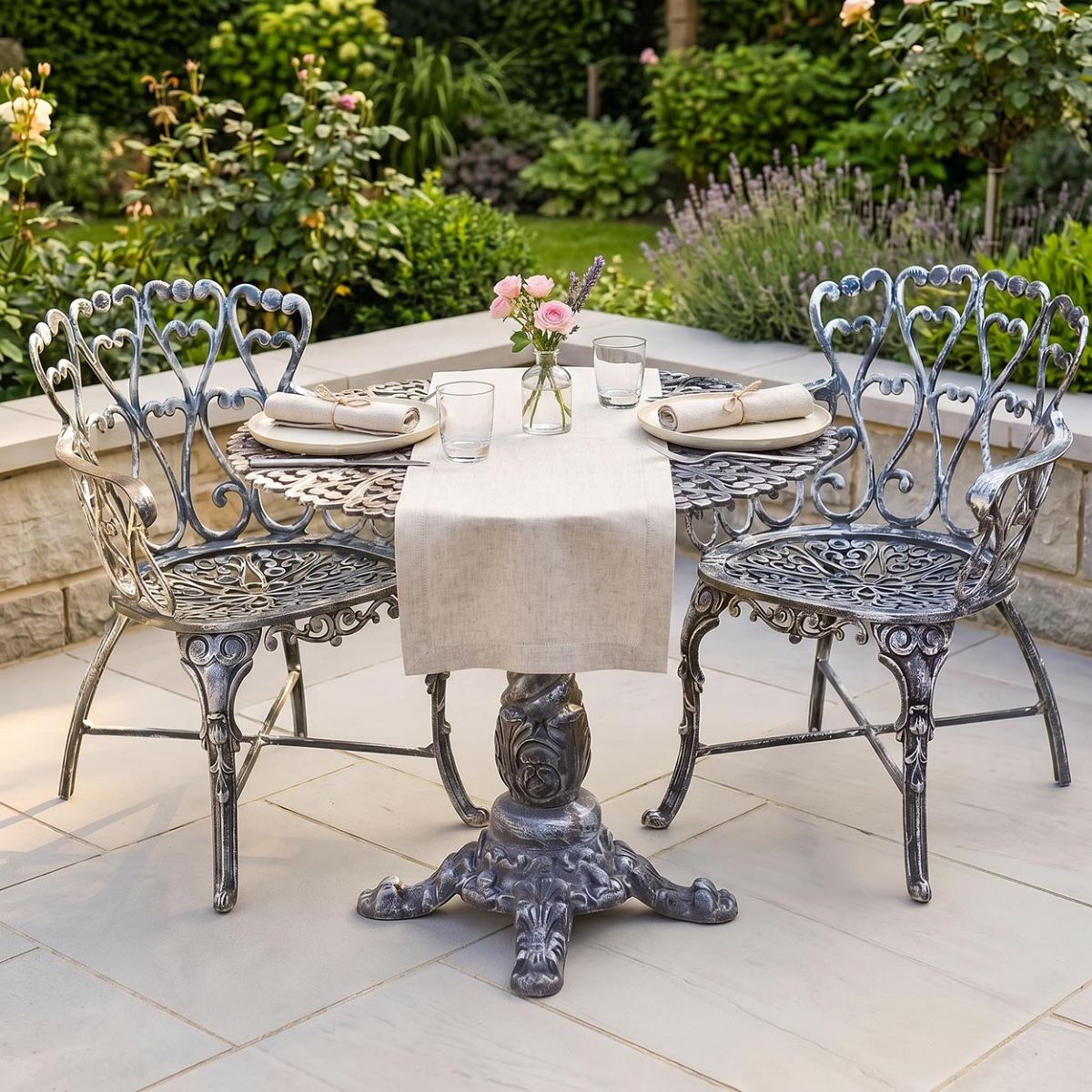 The "Royal Ascott" 2-Seater Outdoor Bistro Set - Antique Silver Digital Illustration With A Dressed Table
