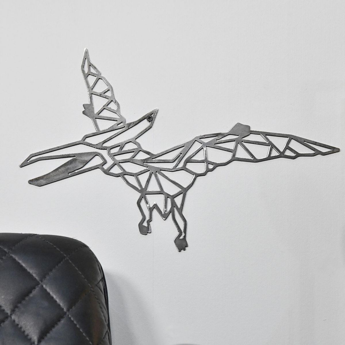 Geometric Natural Steel Pterodactyl Wall Art on a White Wall