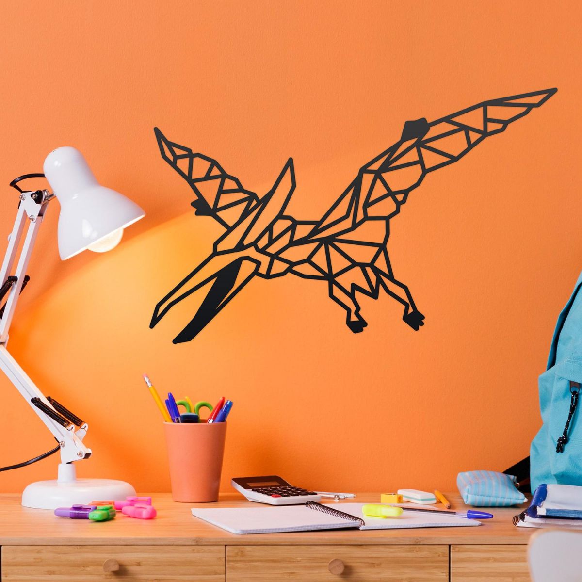 Geometric Iron Pterodactyl Wall Art on an Orange Wall