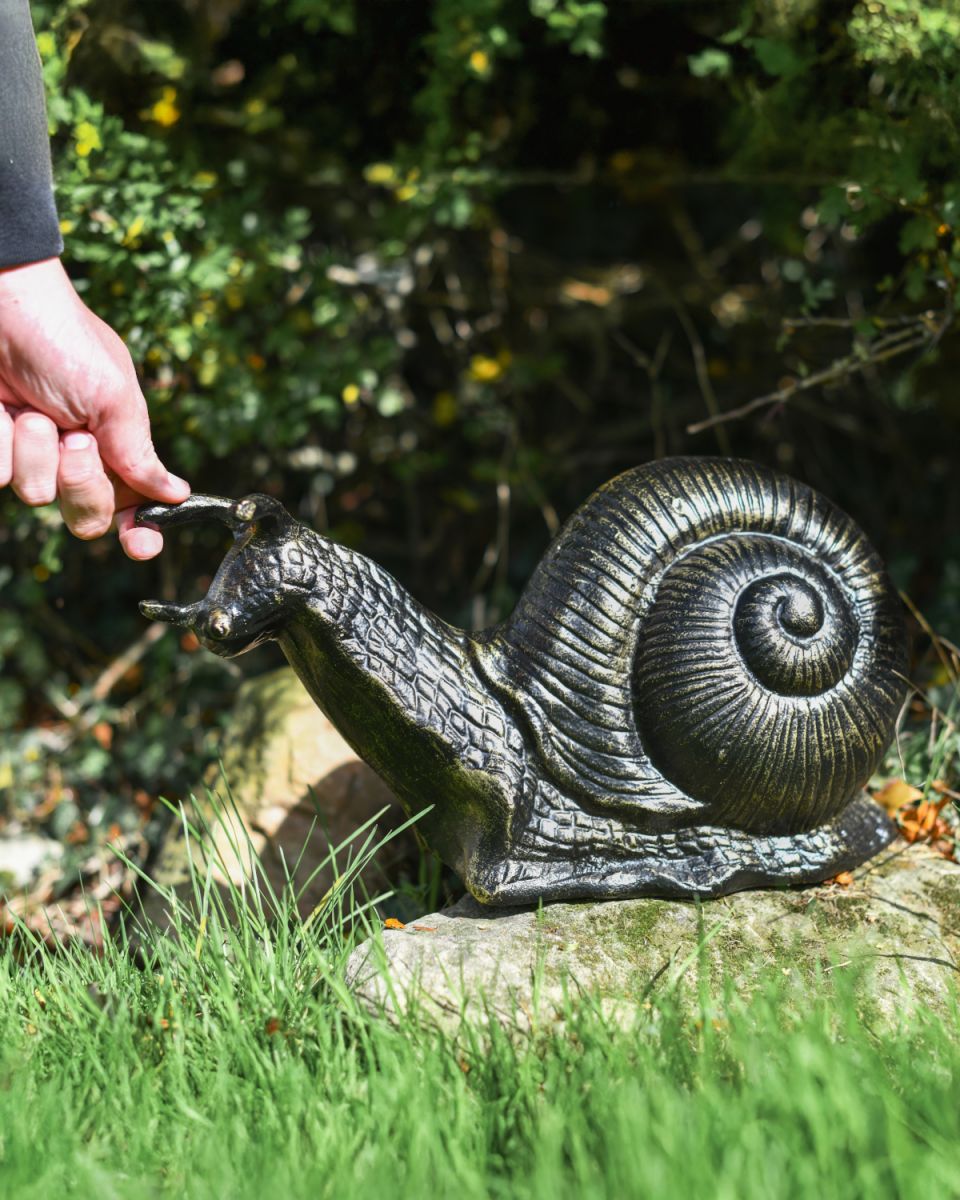 Giant snail black and gold sculpture