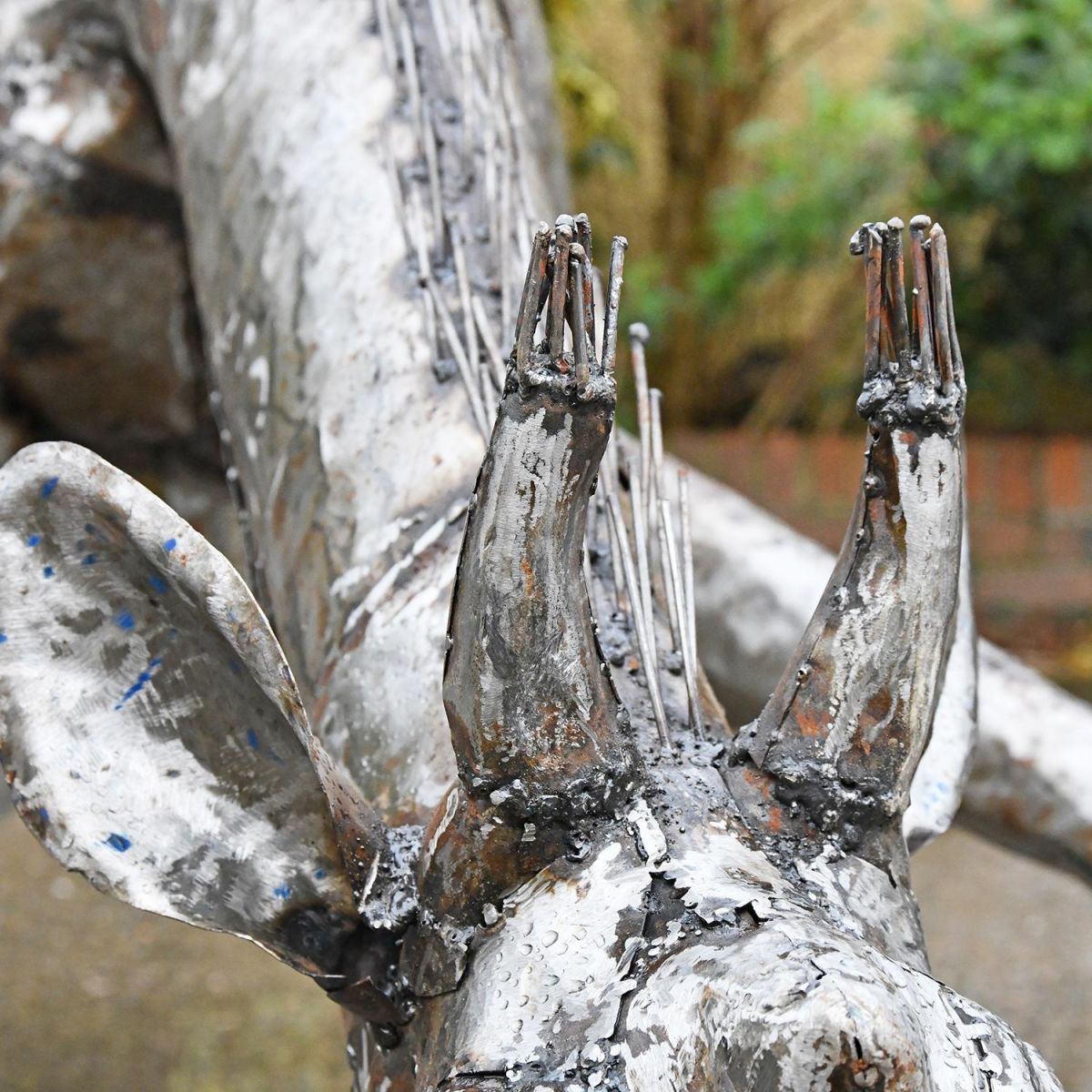 Ears on the Drinking Giraffe Sculpture