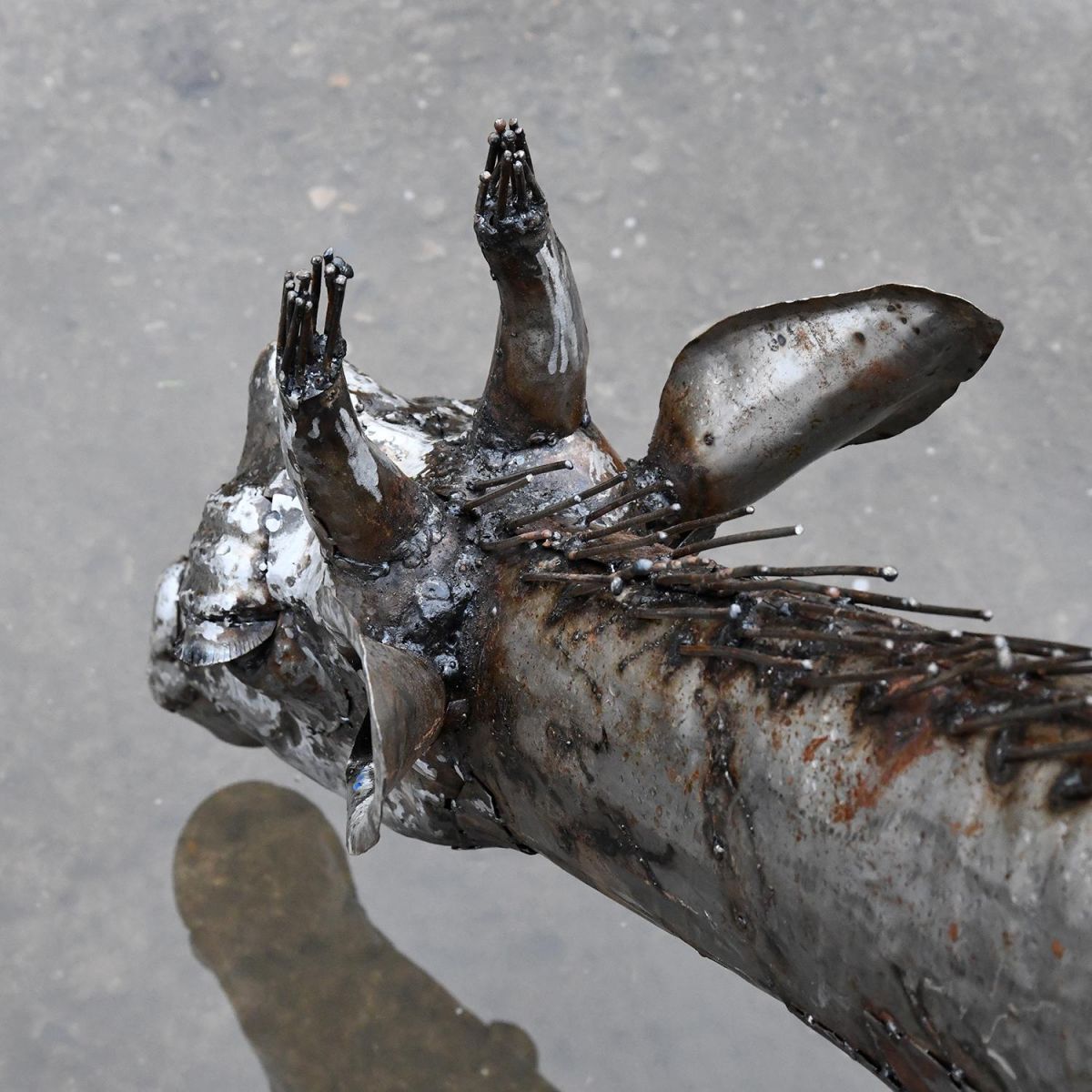  view of the Back of the Drinking Giraffe Sculpture