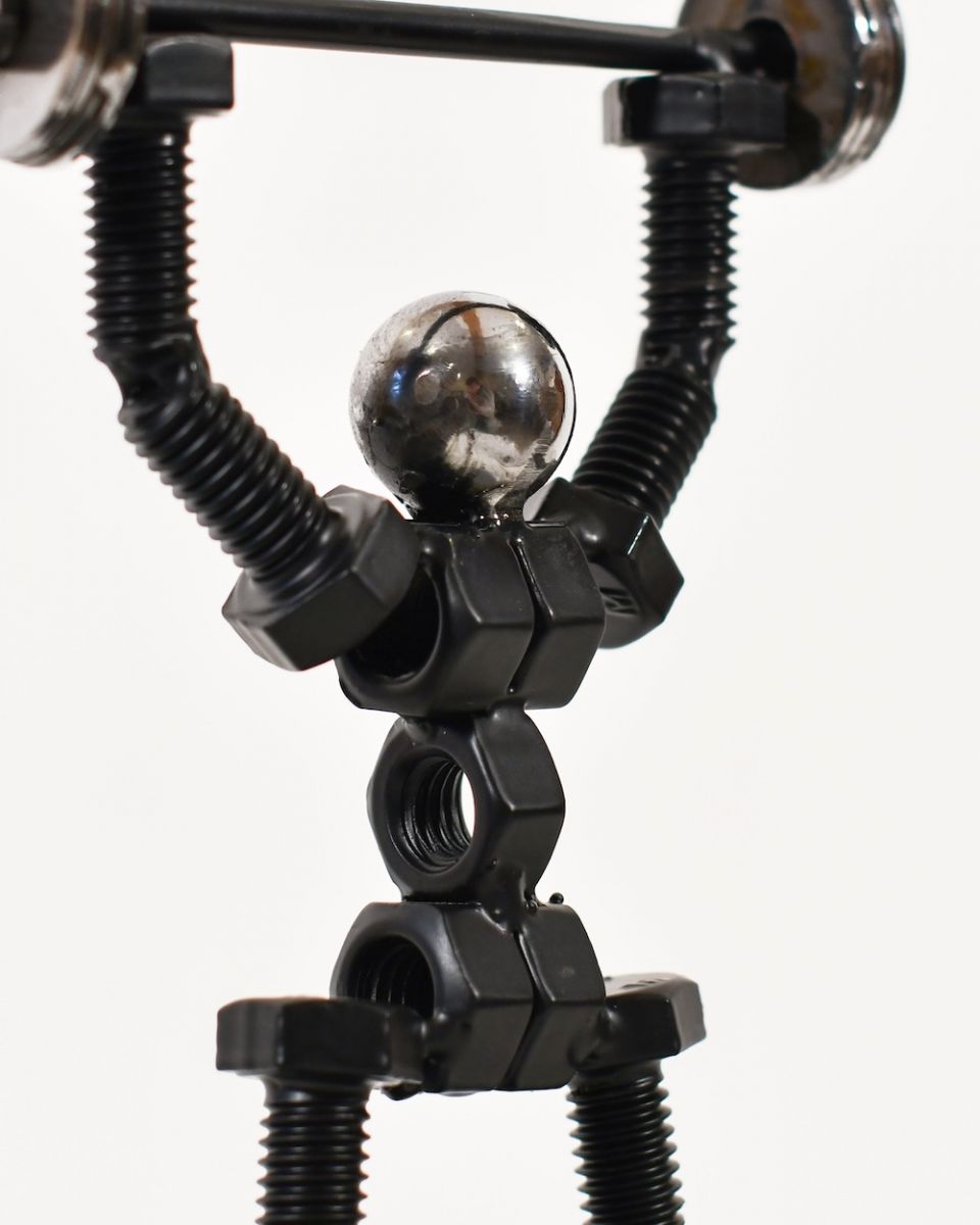 Close up of intricate figure detail on scrap metal art sculpture Close up of intricate figure detail on scrap metal art sculpture