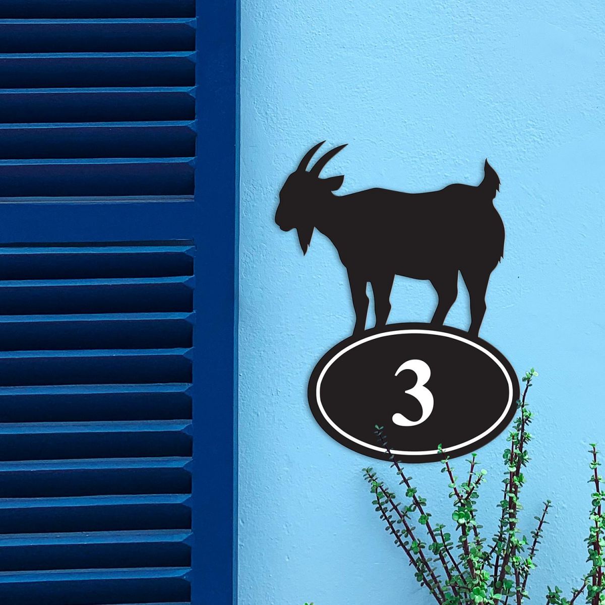 Goat Iron House Number Sign in Situ on a Blue Wall 