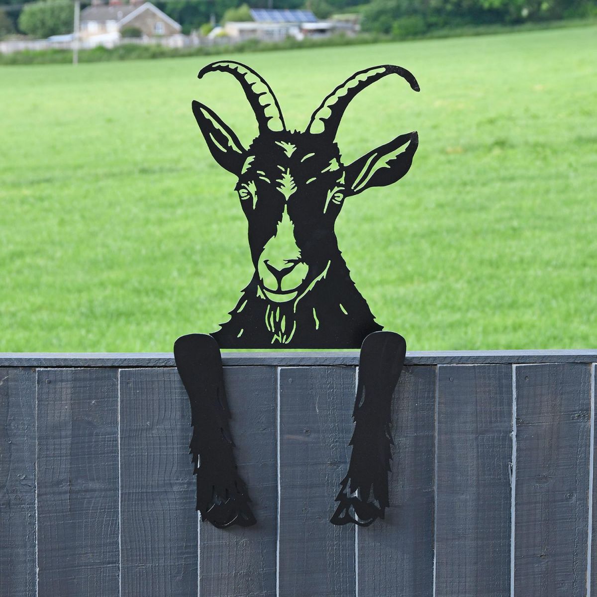 Goat Leaning Fence Topper in Situ in the Garden