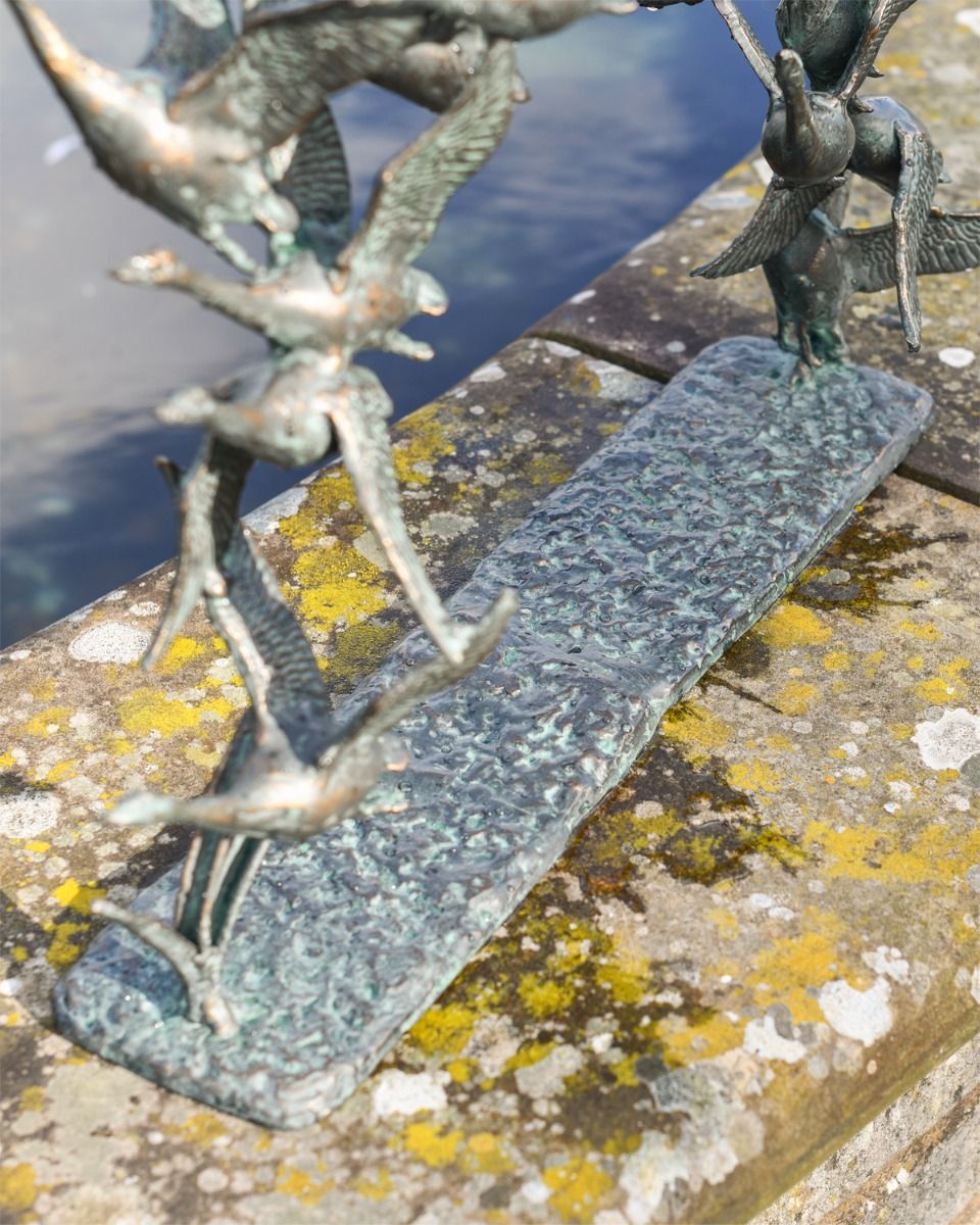 Close up of base for garden sculpture flying ducks 