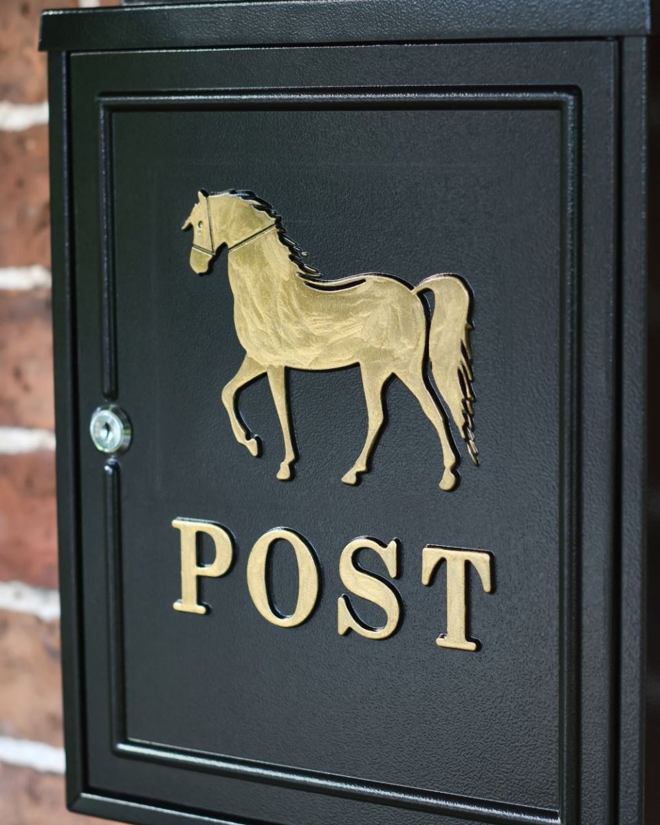 Close up of Gold Horse Wall Mounted Post Box door Close up of Gold Horse Wall Mounted Post Box door