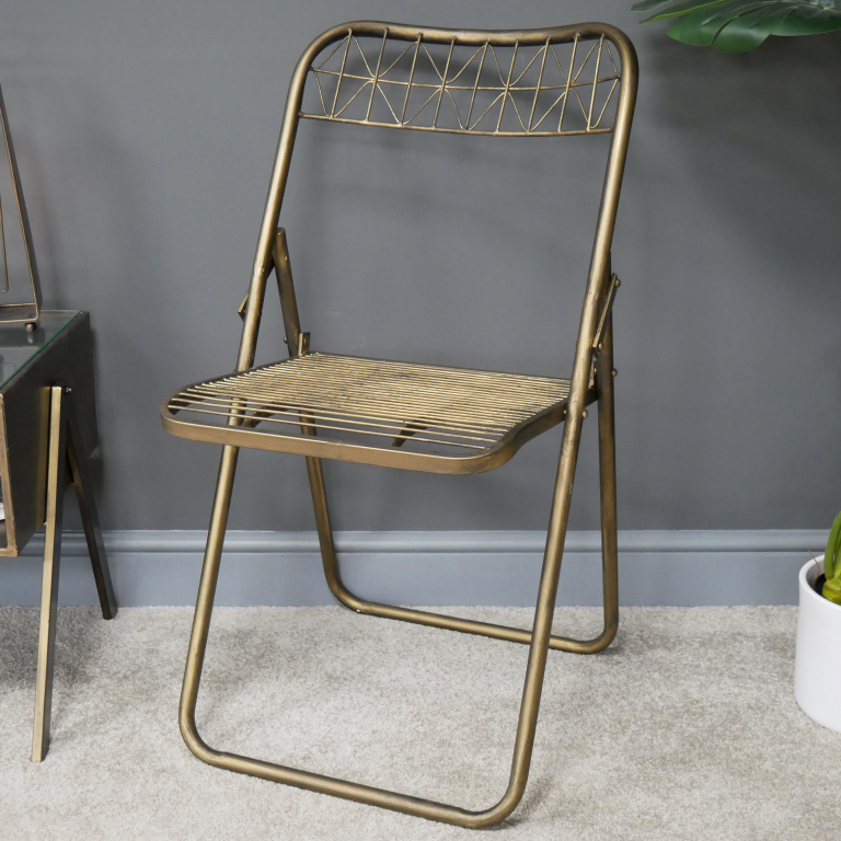 Gold Metal Wire Folding Chair in Situ in the Home Gold Metal Wire Folding Chair in Situ in the Home