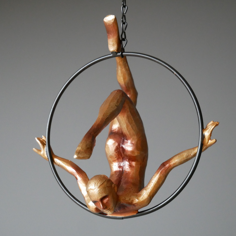 Front View of the Gold Painted Hanging Acrobat Woman Ornament Front View of the Gold Painted Hanging Acrobat Woman Ornament