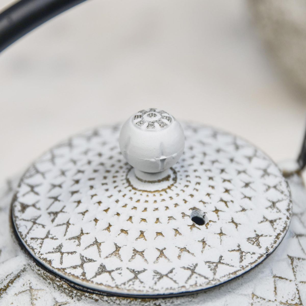 Close Up Of Gold & White Cast Iron Teapot Lid Close Up Of Gold & White Cast Iron Teapot Lid