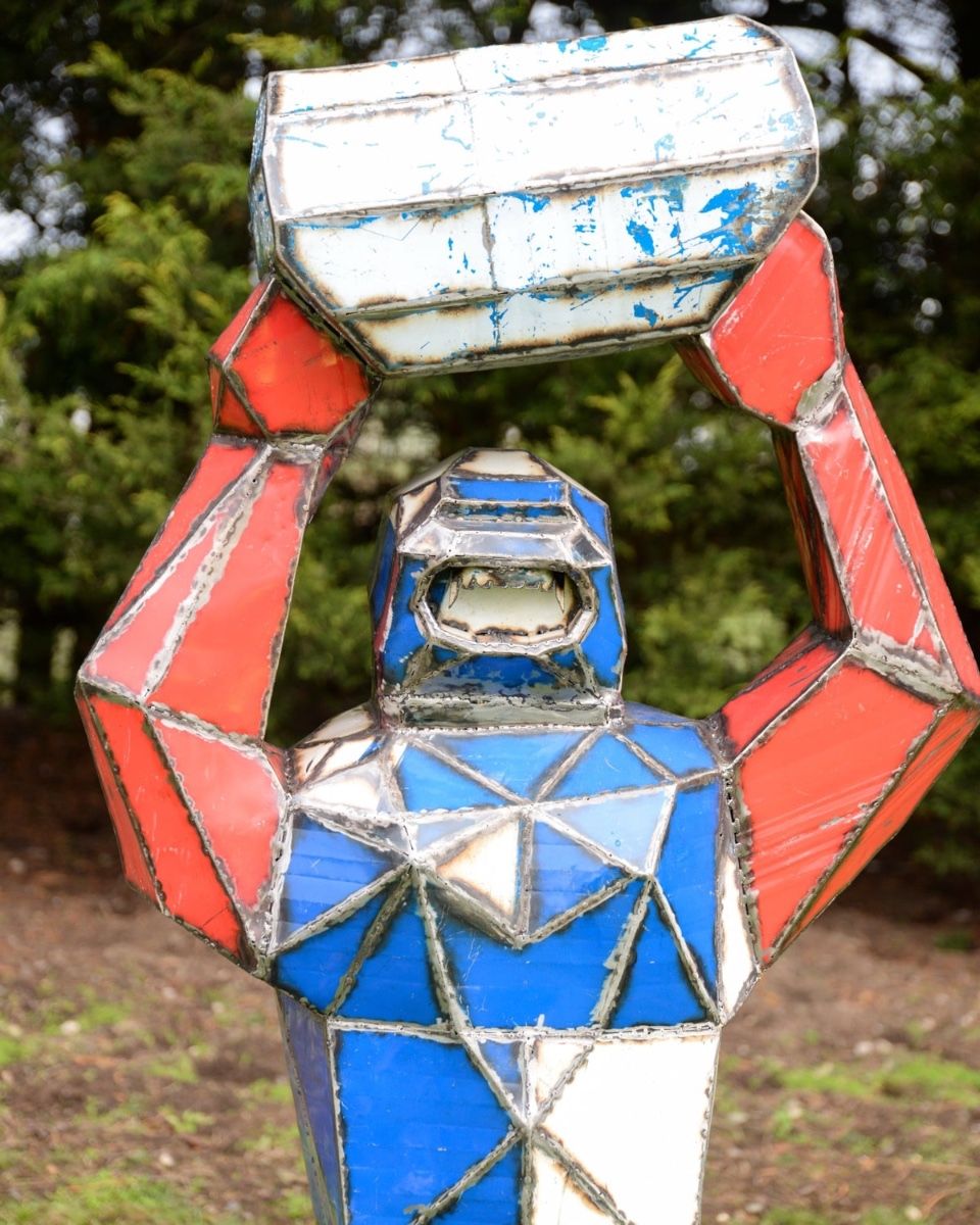 Gorilla Holding Barrel Upcycled Oil Drum Garden Sculpture Close-up Shot
