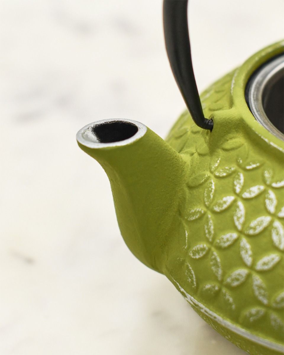 Close up of Green and Embossed Silver Teapot Spout 