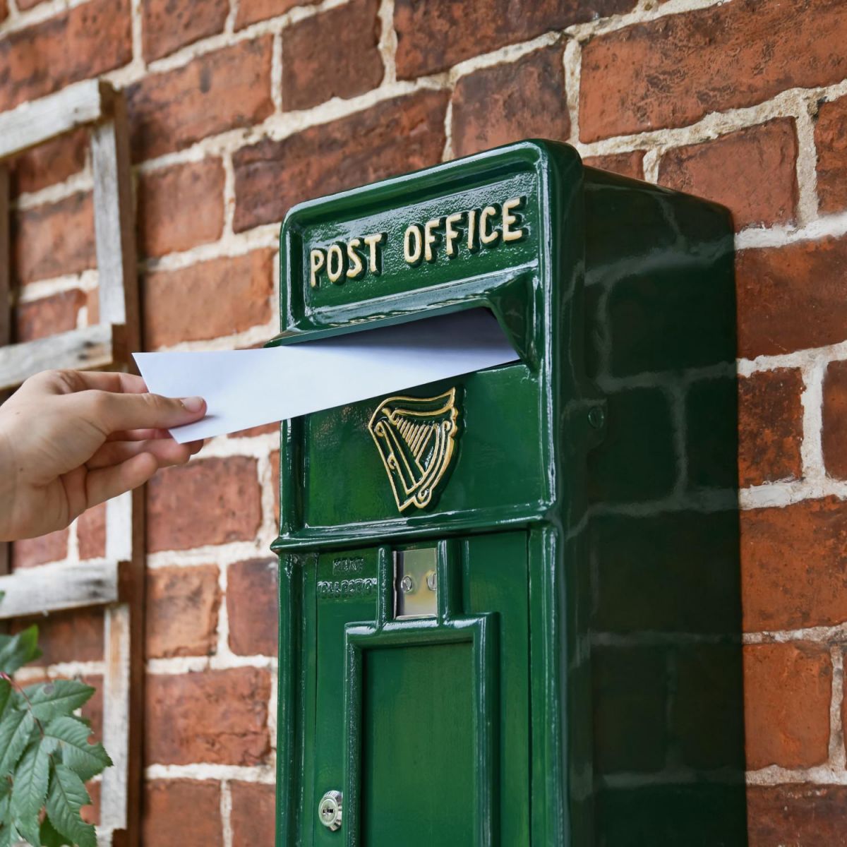 Letter Opening in Use on Green & Gold "Irish Harp" Slim Wall Mounted Post and Parcel Box
