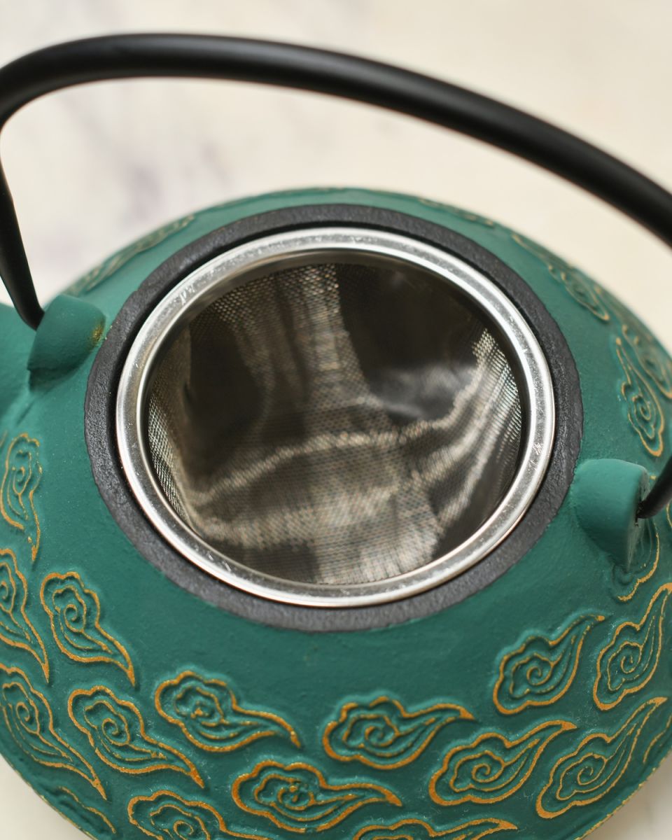 Close up of tea strainer detail on Green & Gold Uwade Style Teapot with Cloud Detailing
