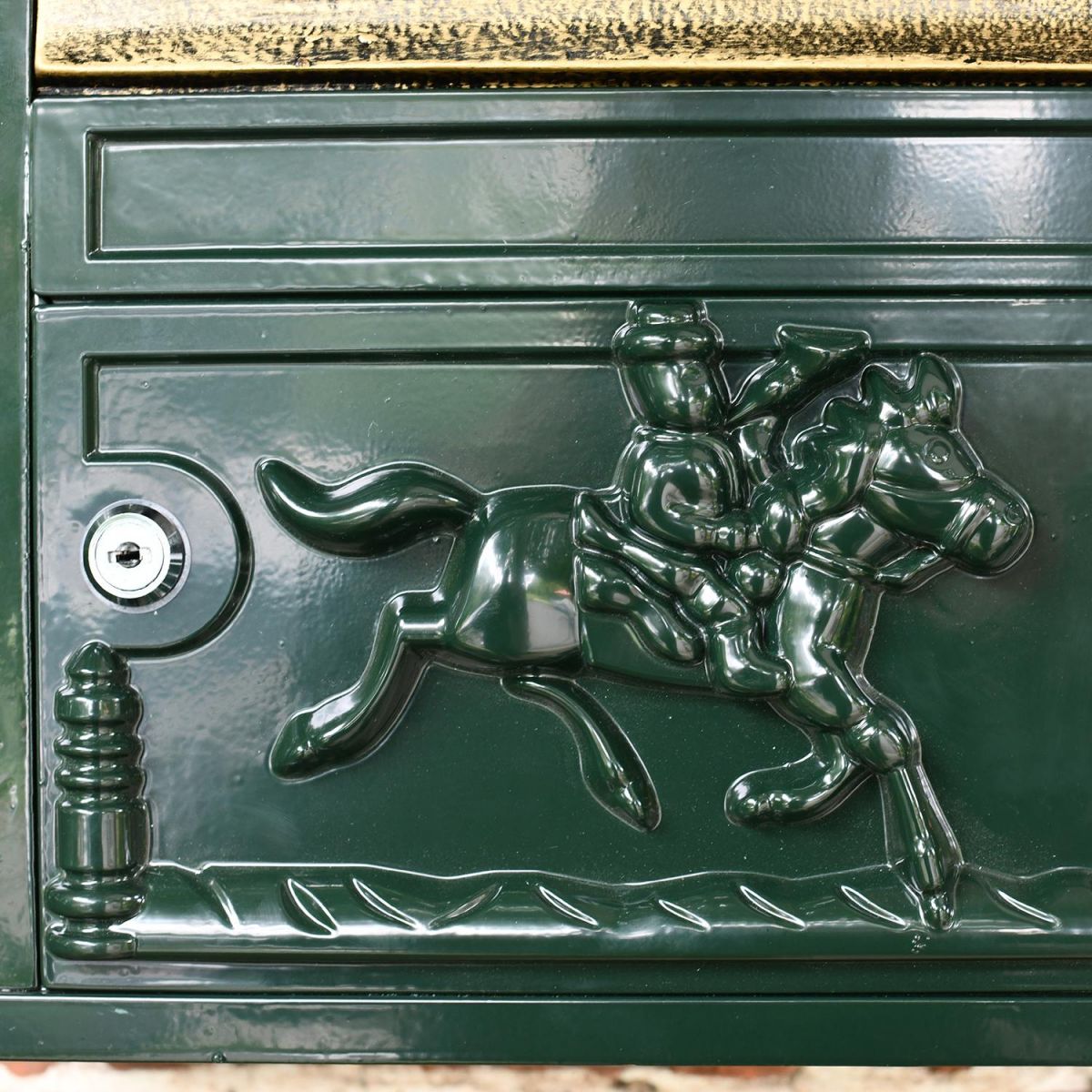 Close-up of the Design on the Green Wall Mounted Post Box